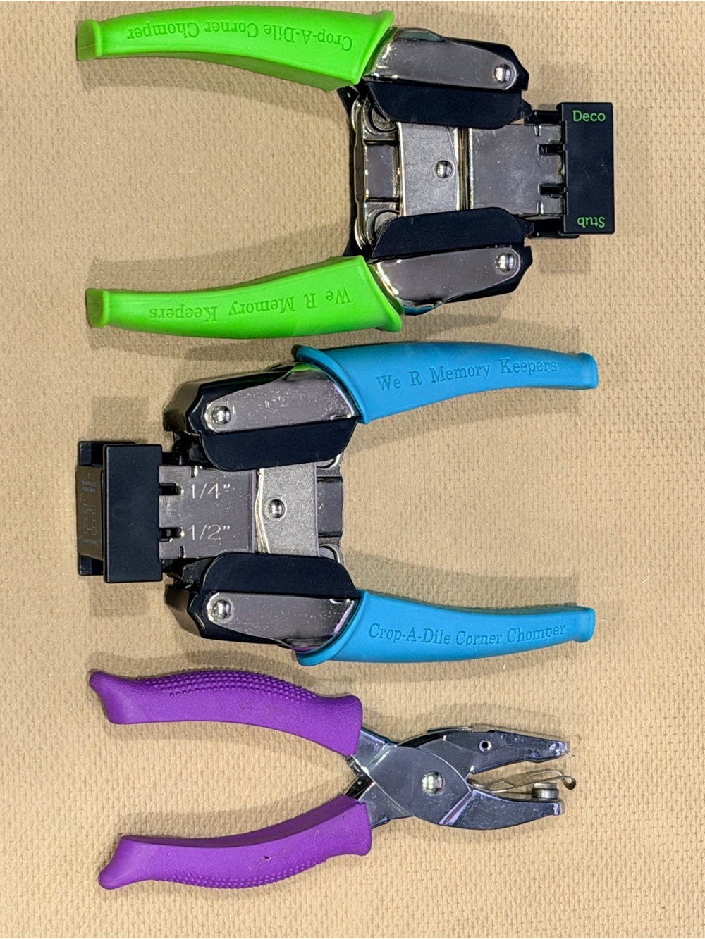 Black Handheld Paper Corner Punch with Teal Guide Markings